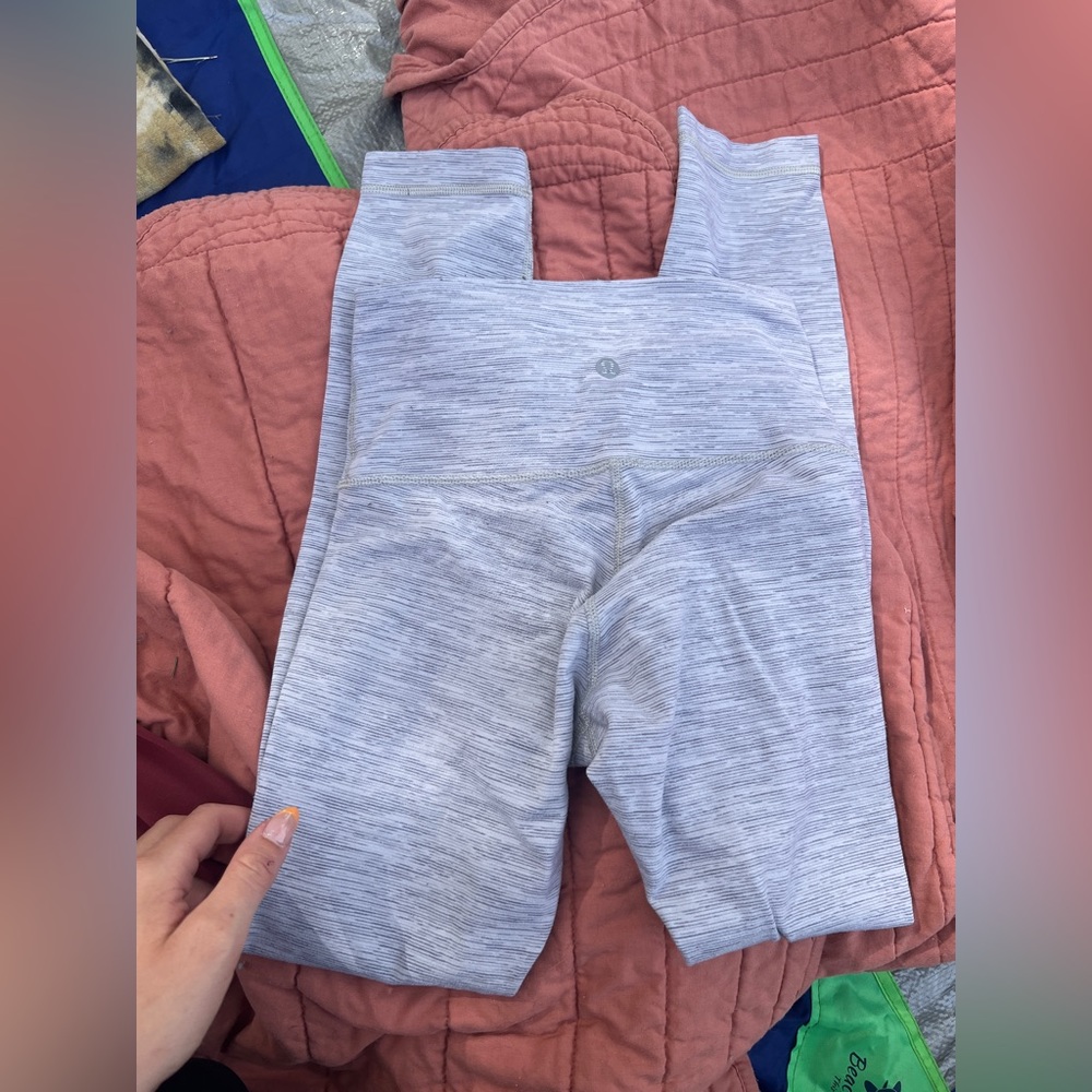 White and grey striped Lululemon 25” Luxtreme leggings